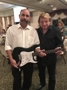 Lou Gramm with the winner of the autographed Fender guitar!
